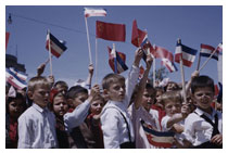 photograph of children waving flags