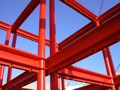 Red girders against a blue sky